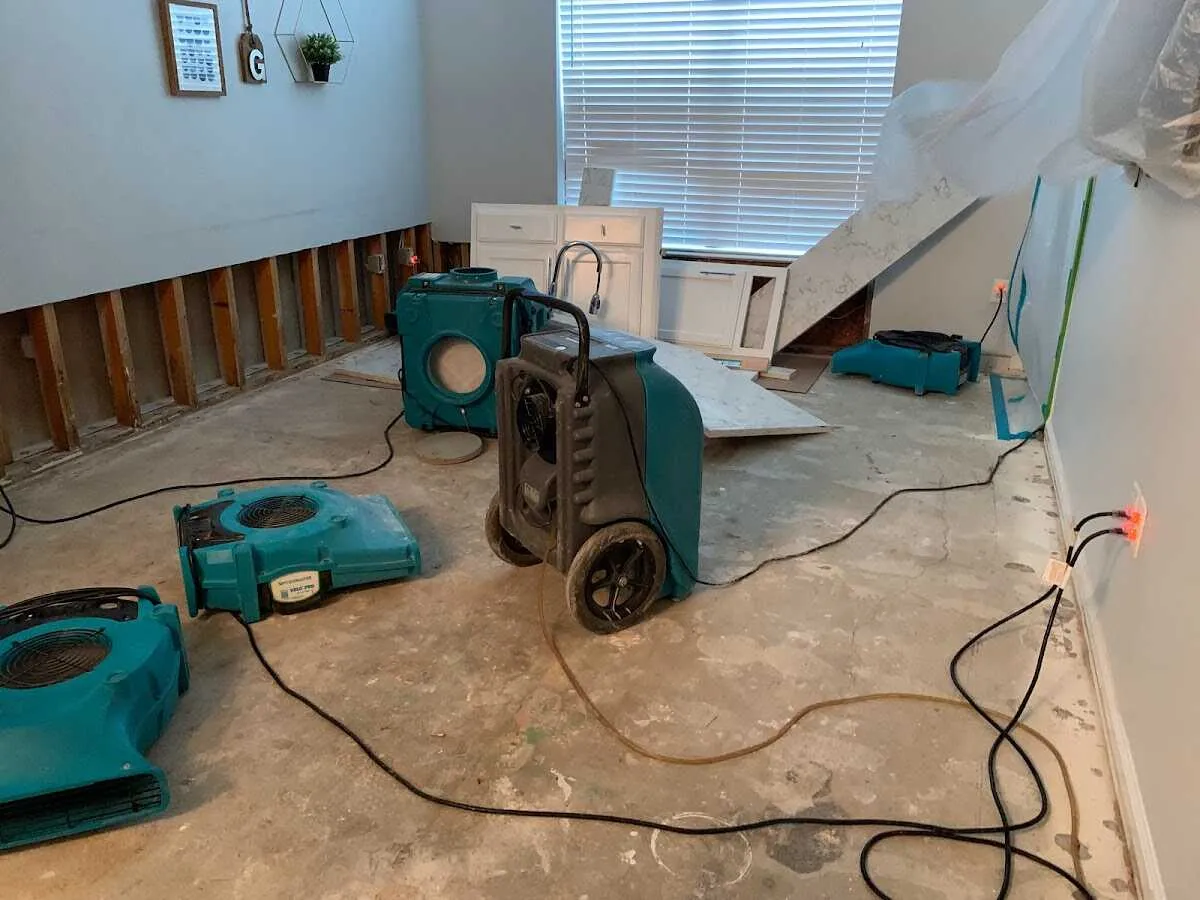 Dehumidifier in flood-cut room for Water Damage Restoration in Englewood