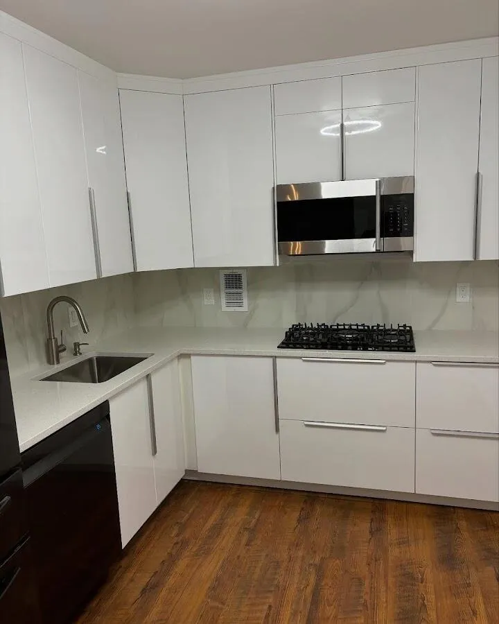 Restored kitchen with white cabinets after water damage in Englewood